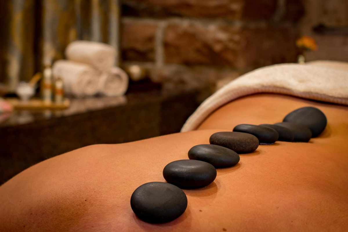 hot stones massage in 'moontaña roja massage' Hot stones on a person's back